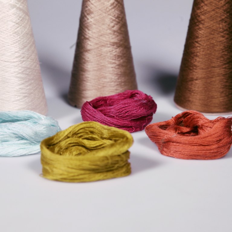 Yarns made of recycled paper and cardboard in different colours.