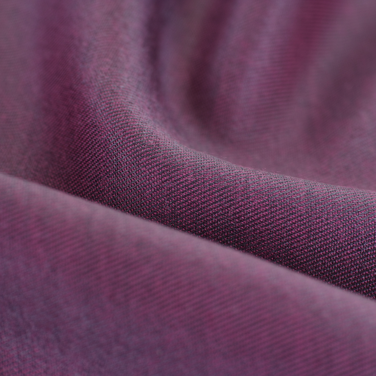 Purple textile wrapped in waves.