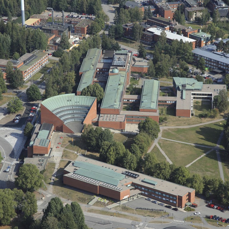 Aerial image of red-brick buildings in the Aalto University campus