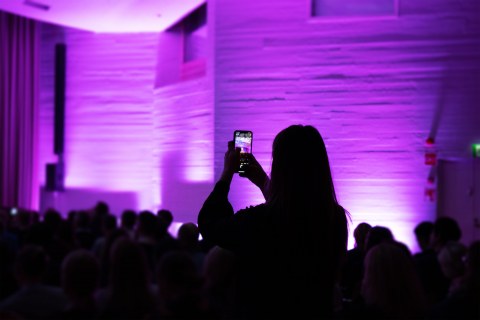 People taking a photo in an event.