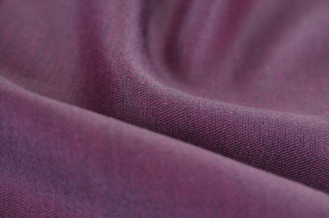 Purple textile wrapped in waves.