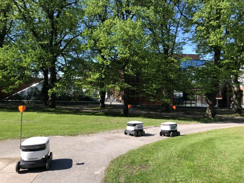 Starship food delivery robots driving in a park