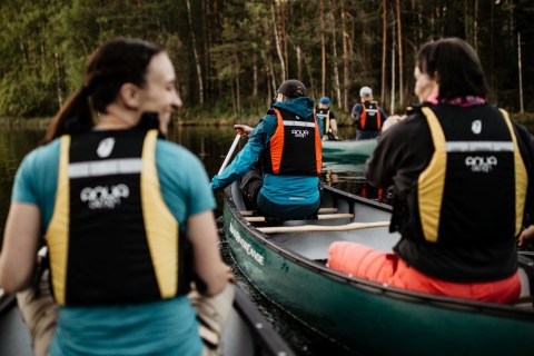 A group canoeing in the Nuuksio National Park