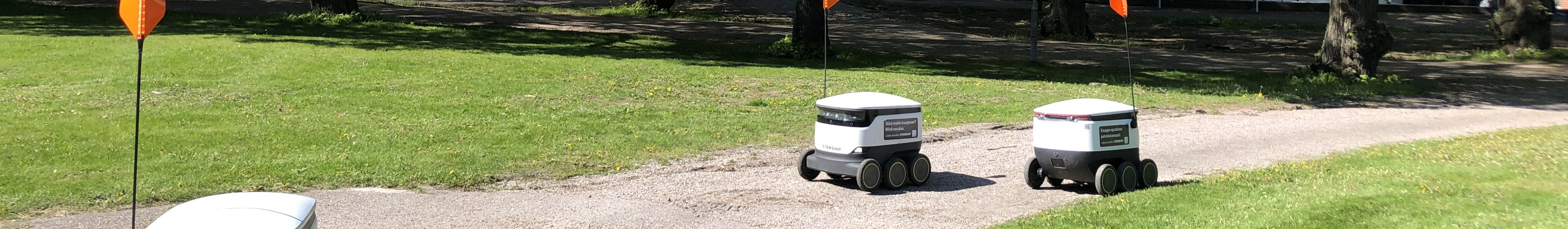 Starship food delivery robots driving in a park