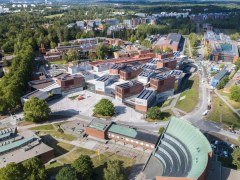 Aerial image of red-brick buildings in the Aalto University campus